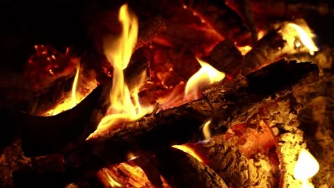 Close shot of crackling fire in dark Stock Footage 135526675