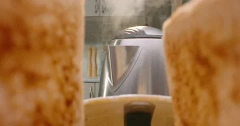 Close up shot of crunchy roasted bread jumping out of toaster with water Stock-Footage 156334759