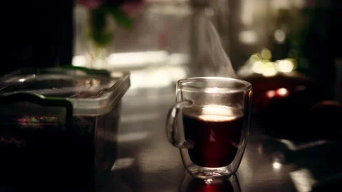 Close up shot with cup of hot coffee or tea and beautiful sun at home Someone Stock Footage 246556774