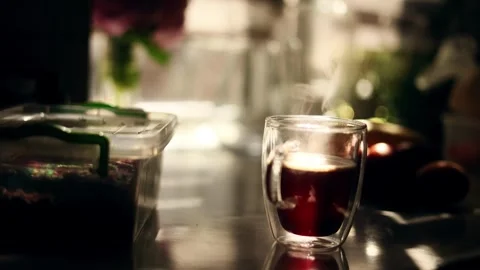 Close up shot with cup of hot coffee or tea and beautiful sun at home Someone Stock Footage 246556793