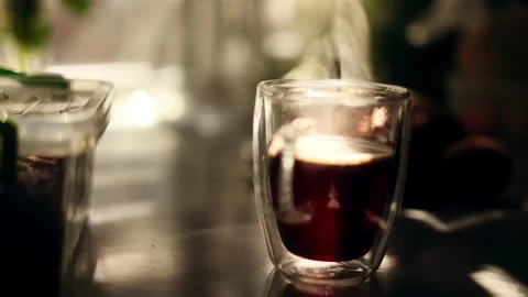 Close up shot with cup of hot coffee or tea and beautiful sun at home Someone Stock Footage 246556802