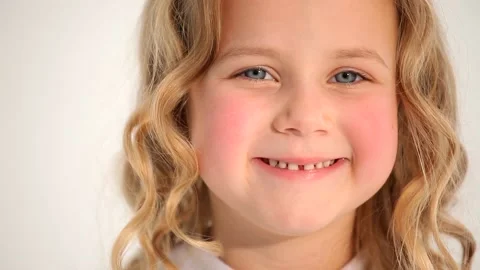Close up shot of cute small nice little child girl toddler with rosy cheeks blon Stockbeeldmateriaal 132674779