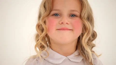Close up shot of cute small nice little girl toddler child with blond curly hair Stock Footage 132674817