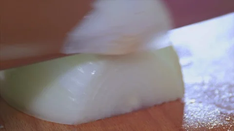 Close up shot of cutting onion in half rings. Slow motion 스톡 동영상 104089187