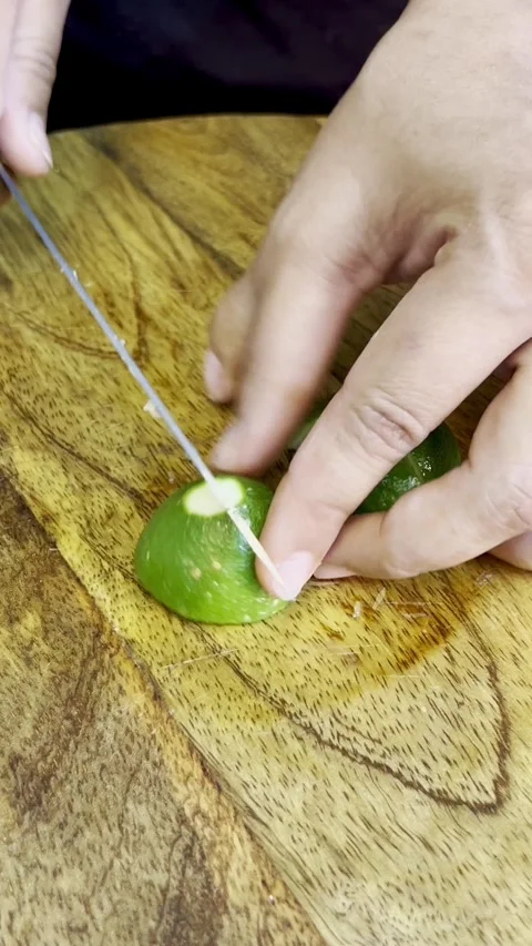 Close up shot of Cutting a raw lemon. raw lemon isolated. Stock Footage 287810373