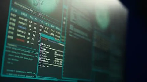 Close up shot of dangerous hacking code running on computer system monitors 写真素材