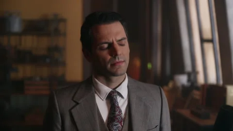 Close-up shot of a dejected man standing in workshop, USA, 1930s - Reenactment Stock Footage 236084213