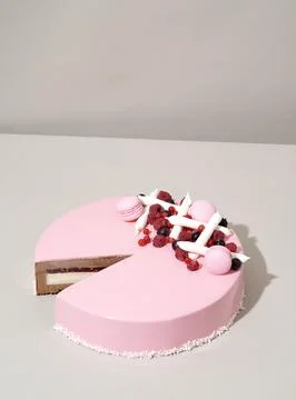 A close-up shot of a delectable cake featuring a raspberry and white chocol.. Stock Photos