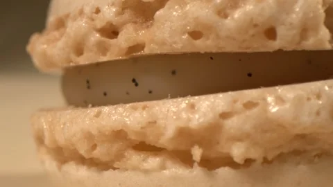 Close shot of delicate vanilla macaroon, Studio scene featuring detailed vanilla Stock Footage 326276447