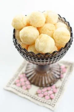 A close-up shot of delicious cheese bread, golden brown  in a vintage glass Foto stock