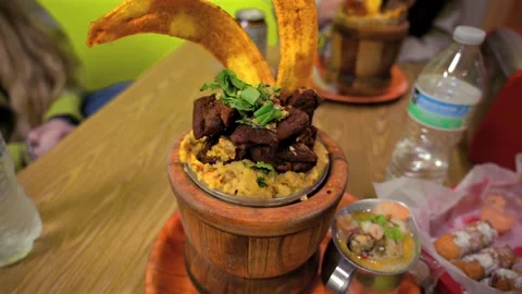 A close-up shot of a delicious mofongo dish made of mashed green plantains Vidéo 335324654