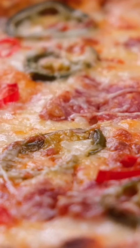 Close up shot of delicious pepperoni pizza with mozzarella cheese straight out Stock Footage 309467313