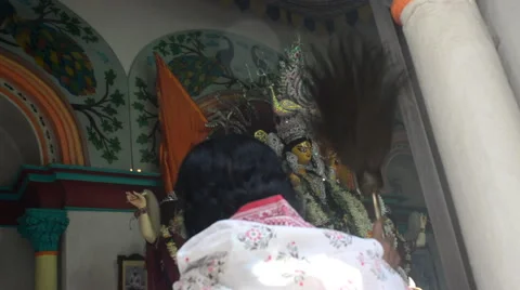 Close shot of devotee comforting god in rich Bengoly family puja in India Stock-Footage 43361534