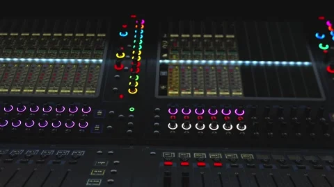 Close Up Shot of Digital Audio Mixer Panel with Colorful Illuminated Knobs 스톡 동영상 322967533