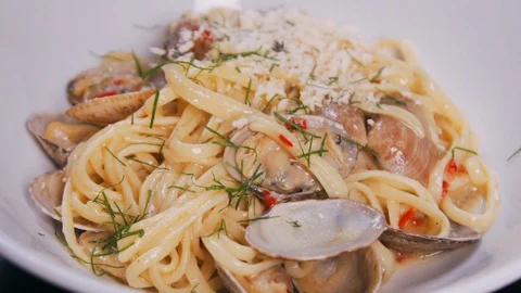 Close up shot as dill decorated pasta in slow motion. Stock Footage 112595633