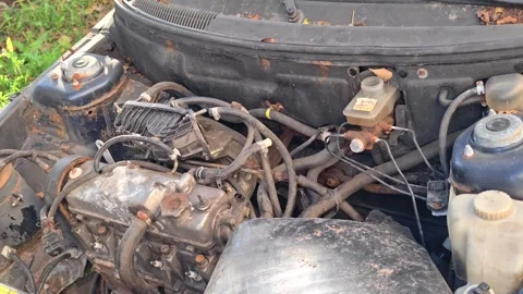 A close-up shot of a dirty car engine in need of repair Stock Footage 344796837
