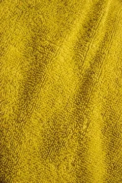 Close-up shot displaying the intricate patterns and texture of a green textile Stock Photos