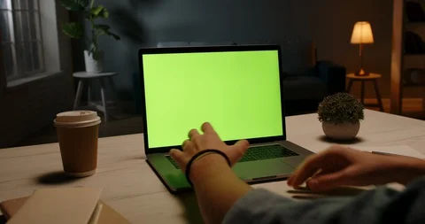 Close up shot of distant worker typing on keyboard of laptop computer with Vidéo 127658793