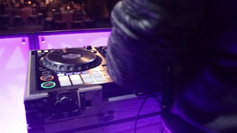 Close up shot of DJ hands on dj console mixer playing music during concert Stock Footage 248407392