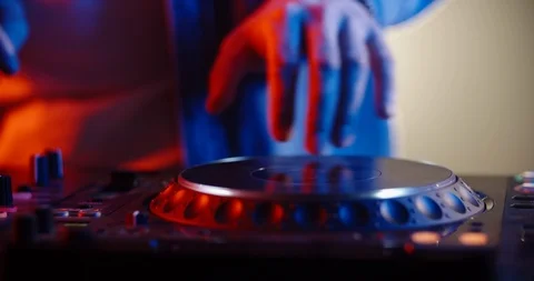 Close-up shot of dj's hands working on mixer controller, turning the knobs and 스톡 동영상 120267185