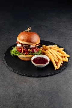 Close-up shot of a double-layer burger, crispy golden French fries. Foto stock
