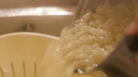 Close up shot of draining cooked pasta Stock Footage 120708766