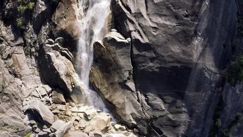 Close up shot of a dramatic waterfall on cliff face Видео 111955745