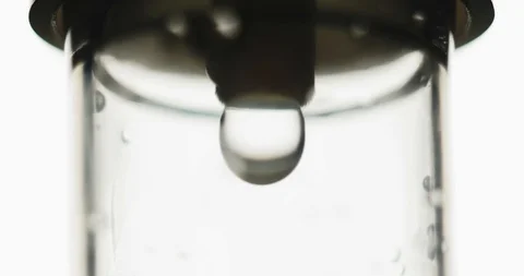 Close-up shot: Dropper. Liquid or saline slowly dripping in center of frame 스톡 동영상 126159350