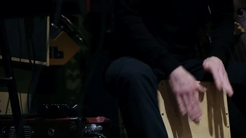 Close up shot of drummer playing live music on cajon with drum brushes Stock Footage 126933735