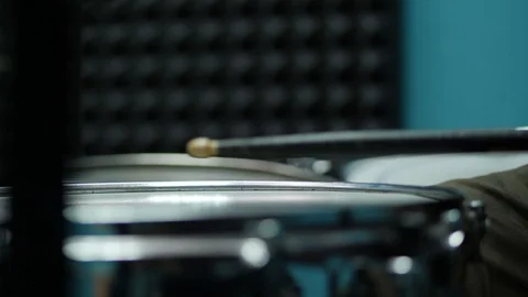 Close up shot of drumstick in drummer's hands playing on drum set Video stock 90284280