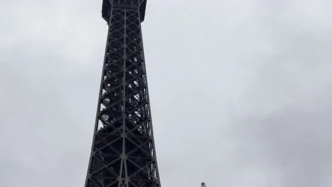 Close up shot Eiffel tower Paris with bird  in winter 4k Stock Footage 236108983