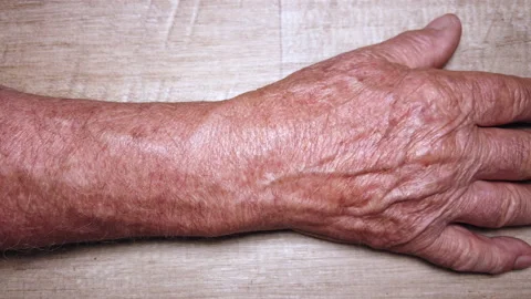 Close-up shot on an eighty year old adult male hand Stock Footage 155731587