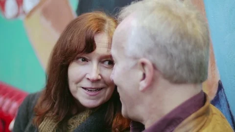 Close up shot of an elderly loving couple having a conversation on a bench 스톡 동영상 83038168