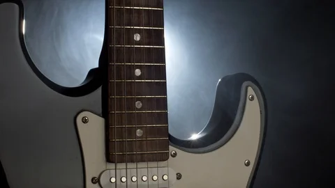 Close up shot of electric guitar. Soffits light and smoke on the stage before Vídeo Stock 99147136