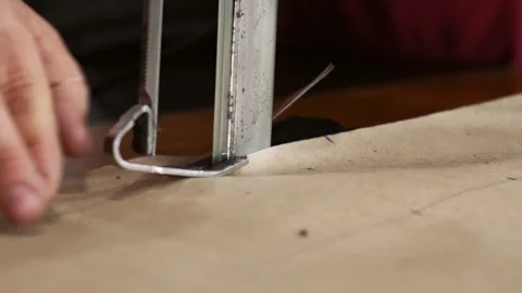 Close up shot of electric sewing machine cuts fabric. Sewing production line Stock Footage 151140761
