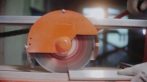 Close-up shot of electric tile cutter cutting ceramic tile Video stock 170501632