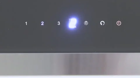 Close shot of an electronic led panel, hand changing the speed with touch button Stock Footage 147252144