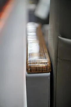 Close-up shot of an elegant wooden pattern armrest on a modern transport Stock Photos