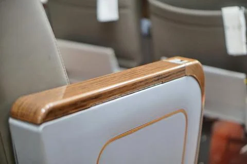Close-up shot of an elegant wooden pattern armrest on a modern transport Stock Photos