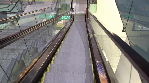 Close-up shot of empty moving staircase running up and down. Modern escalator Stock Footage 97109658