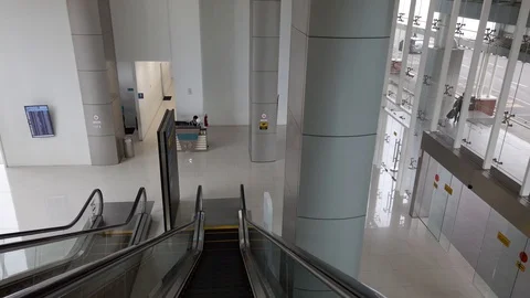 Close-up Shot of Empty Moving Staircase Running up and down Stock Footage 129895056