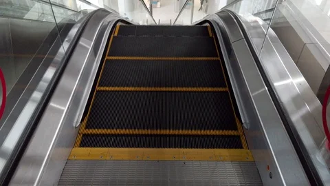 Close-up Shot of Empty Moving Staircase Running up and down Stock Footage 129895844