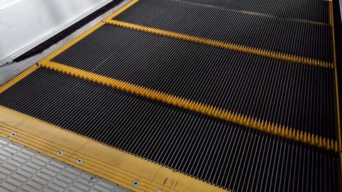 Close-up Shot of Empty Moving Staircase Running up and down Stock Footage 129904059