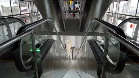 Close-up Shot of Empty Moving Staircase Running up and down Stock Footage 129905327
