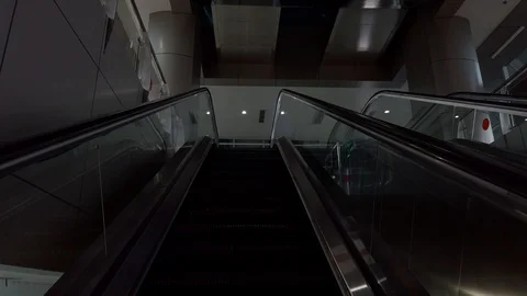 Close-up Shot of Empty Moving Staircase Running up and down Stock Footage 129905563