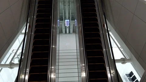 Close-up Shot of Empty Moving Staircase Running up and down Stock Footage 129908865