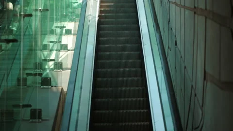 Close-up shot of empty moving staircase running up and down. Modern escalator Stock Footage 201891851