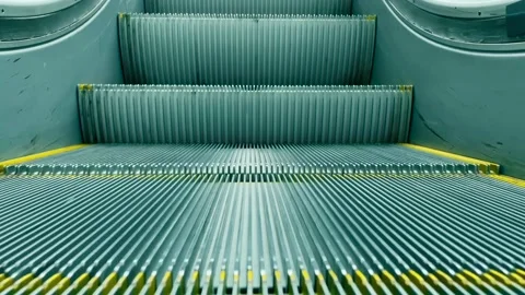 Close-up shot of empty moving staircase running down. Escalator stairs. Stock Footage 216857257