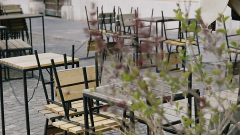 Close up shot of empty tables and chairs in the bar, restaurant, Ljubljana Stock Footage