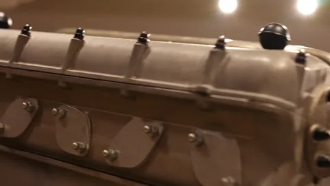 Close-up shot of engine layout with its distinct twelve-cylinder design in a V Stock Footage 318230140